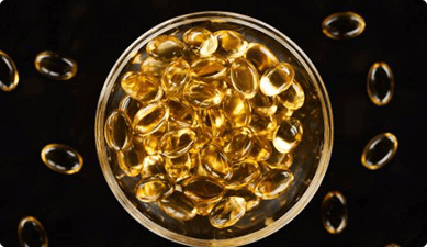 Bowl of fish oil capsules