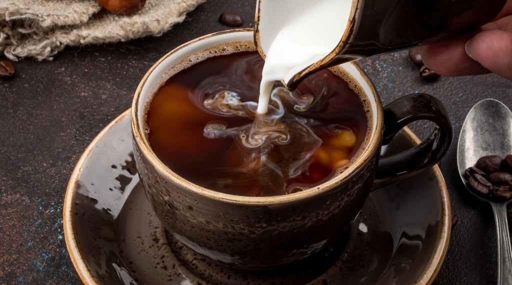 Is Flavored Coffee Fattening? The Truth & Calorie Facts 1 Woman enjoying a cup of black flavored coffee