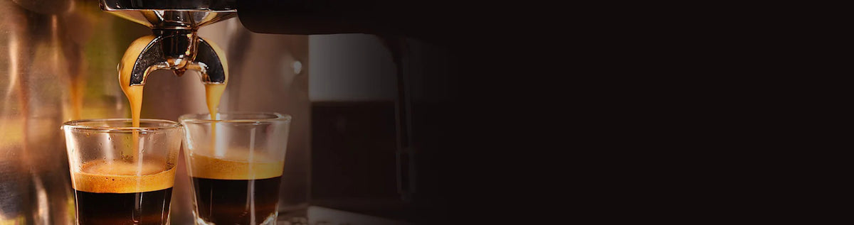 Espresso pouring into two glasses
